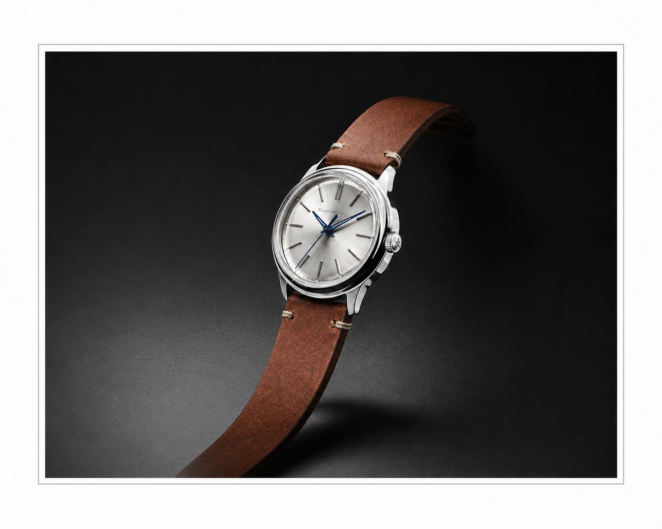 Montre G. Gagnebin & Cie, cadran argenté et bracelet de cuir brun